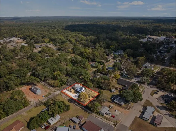 an aerial view of residential house with outdoor space