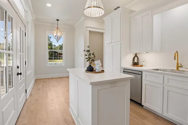 a kitchen with stainless steel appliances a refrigerator and a stove