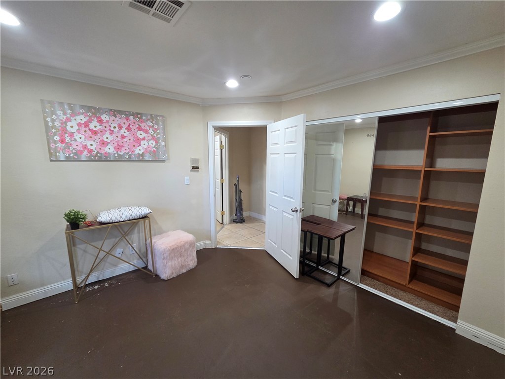3381 Westwind Road Las Vegas, NV 89146 - Photo 27 of 52 Well-lit room featuring practical built-in shelving, ready for personalization.