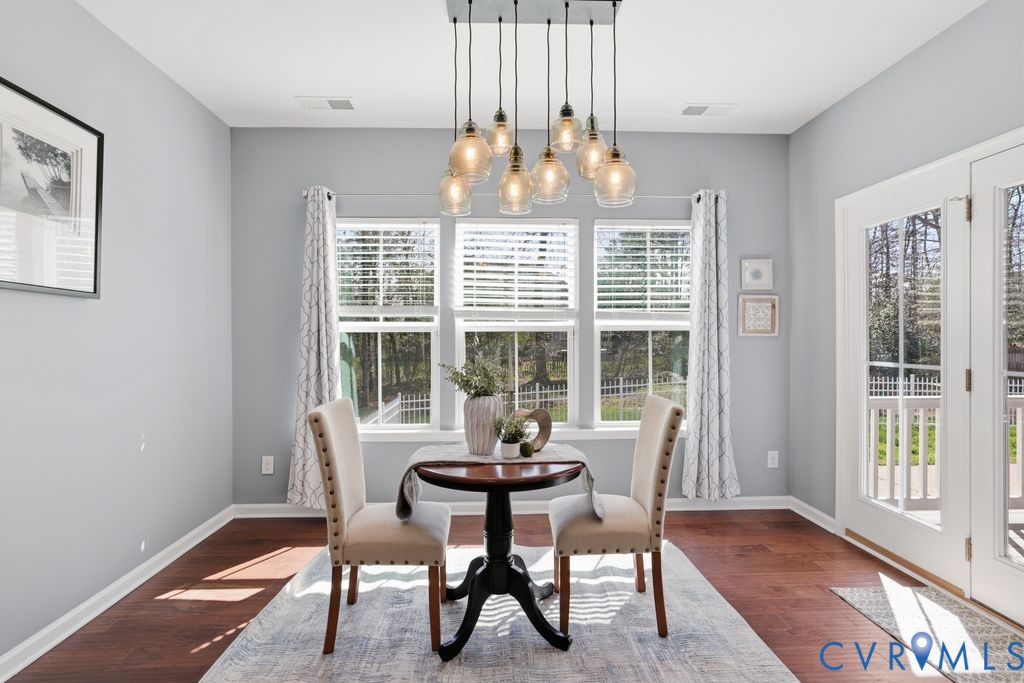 8712 Bailey Hill Road Midlothian, VA 23112 - Photo 18 of 46 a dining room with furniture window and outside view