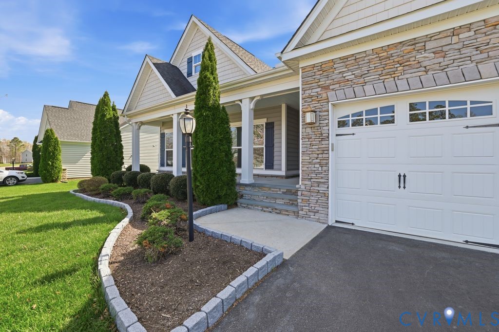 8712 Bailey Hill Road Midlothian, VA 23112 - Photo 2 of 46 front view of a house with a yard