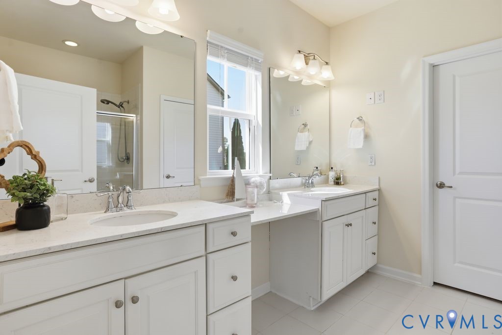 8712 Bailey Hill Road Midlothian, VA 23112 - Photo 24 of 46 a bathroom with a double vanity sink mirror and
