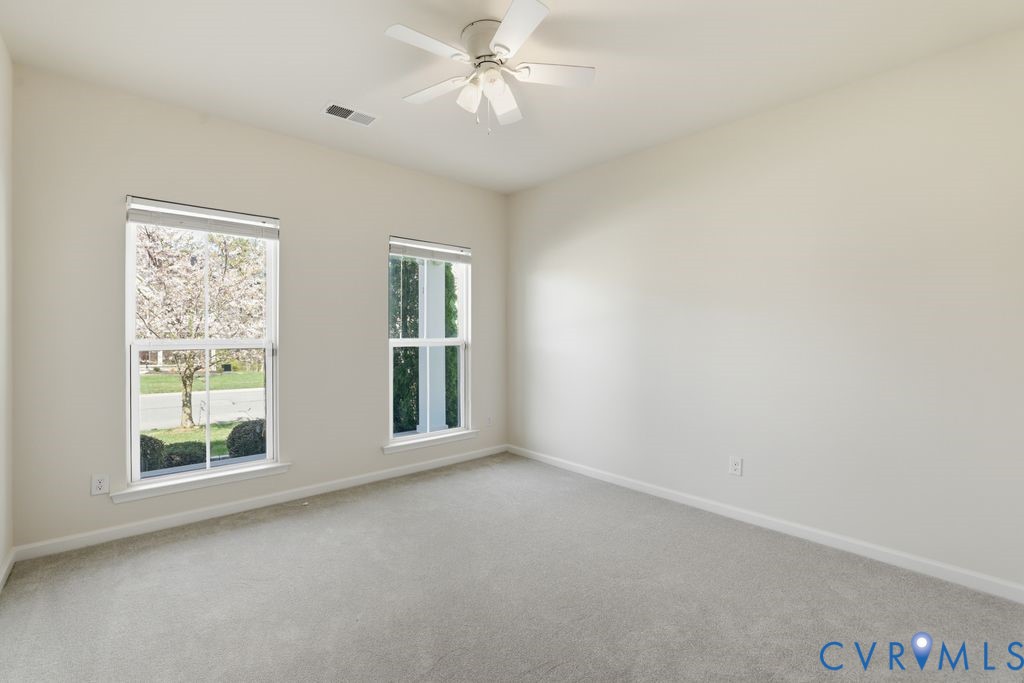 8712 Bailey Hill Road Midlothian, VA 23112 - Photo 29 of 46 an empty room with windows and closet