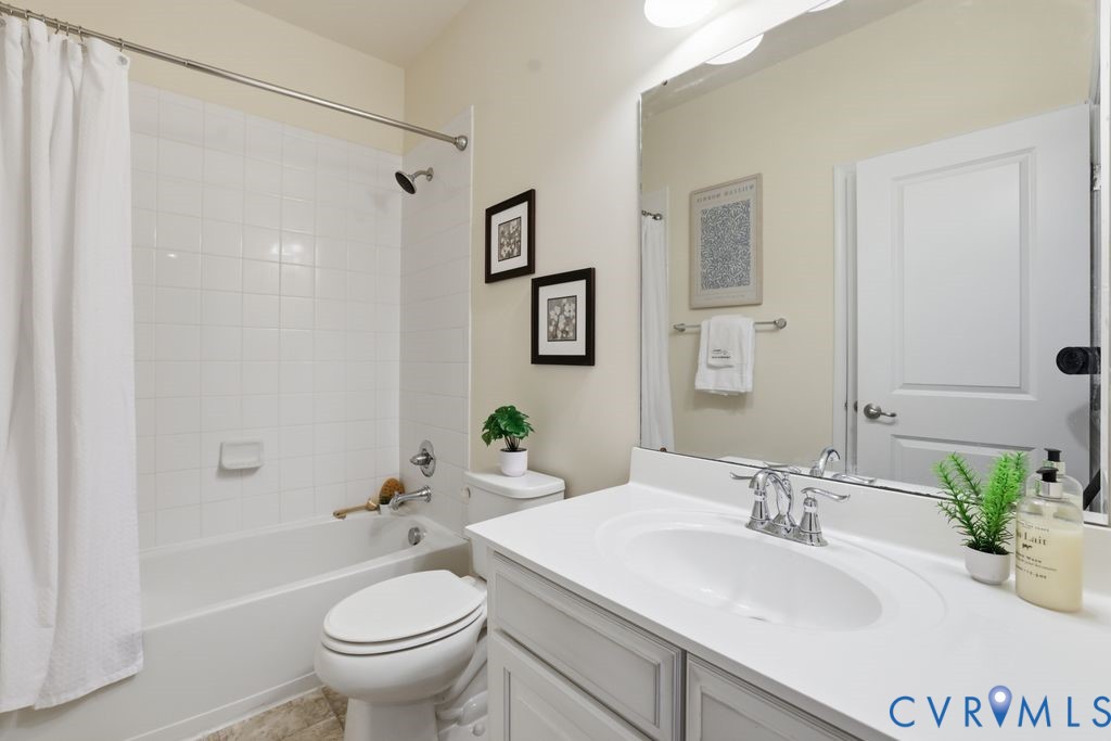 8712 Bailey Hill Road Midlothian, VA 23112 - Photo 31 of 46 a bathroom with a sink toilet and shower