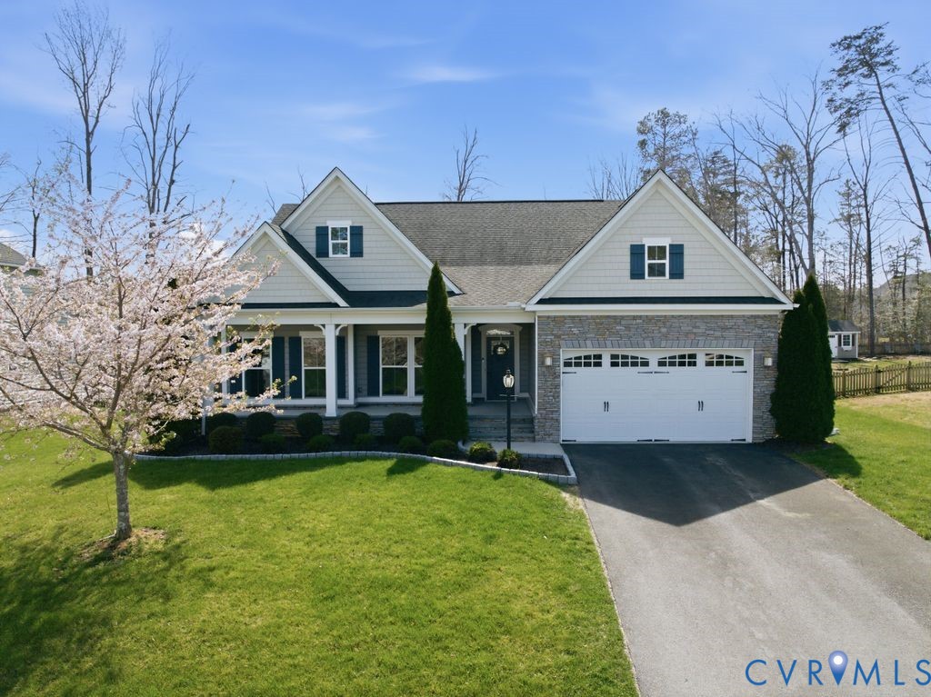 8712 Bailey Hill Road Midlothian, VA 23112 - Photo 39 of 46 a front view of a house with a garden and yard