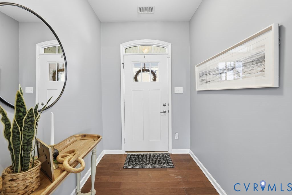 8712 Bailey Hill Road Midlothian, VA 23112 - Photo 7 of 46 a view of a hallway with paintings on the wall