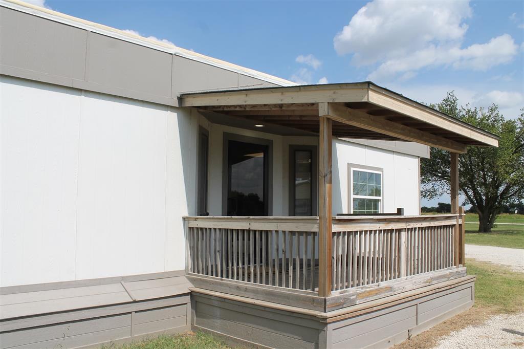 5259 Fm 156 Street North, Unit 6 Krum, TX 76249 - Photo 1 of 16 a view of a house with a porch