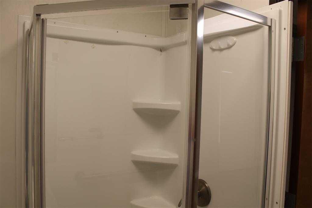 5259 Fm 156 Street North, Unit 6 Krum, TX 76249 - Photo 15 of 16 a bathroom with a shower