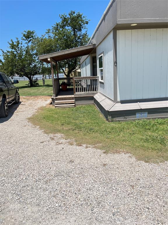 5259 Fm 156 Street North, Unit 6 Krum, TX 76249 - Photo 16 of 16 front view of a house with a yard