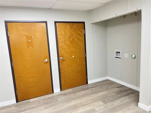 a view of a bathroom with a glass door and a bathroom