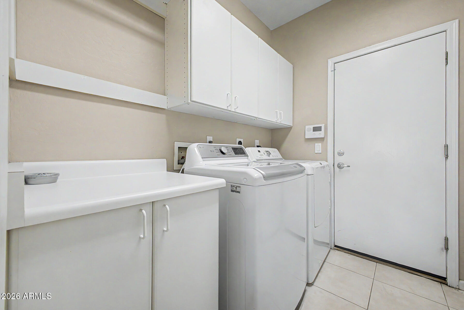 1632 West Frye Road Phoenix, AZ 85045 - Photo 23 of 37 a utility room with dryer and washer
