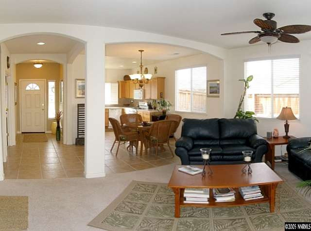 9510 Rusty Nail Drive Reno, NV 89521 - Photo 3 of 9 a living room with furniture and a flat screen tv