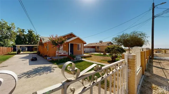 a front view of house with deck and outdoor seating