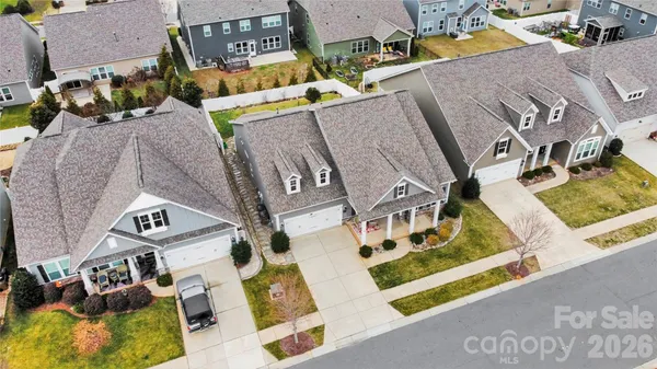 an aerial view of a building with parking