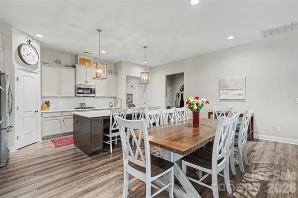 a view of kitchen with cabinets and wooden floor