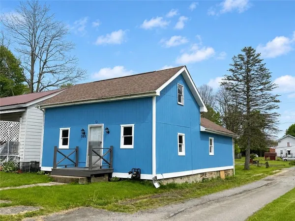 a front view of a house with a yard