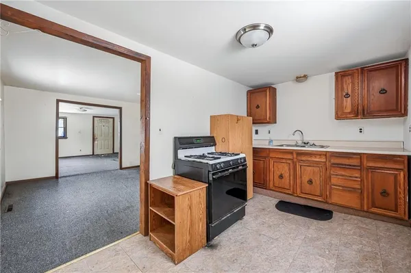 a kitchen with a stove a refrigerator and a stove