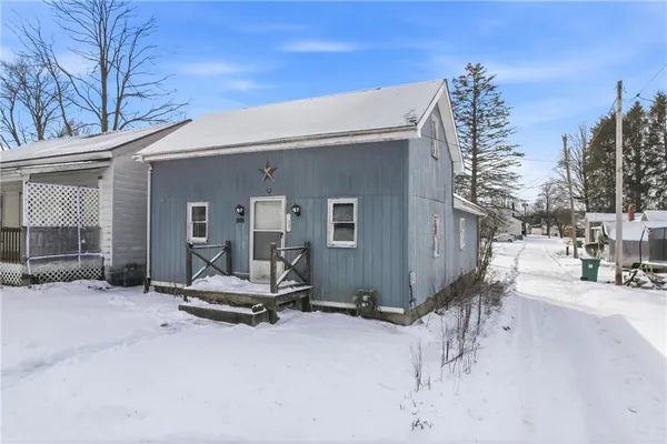 a view of a patio with a table and chairs