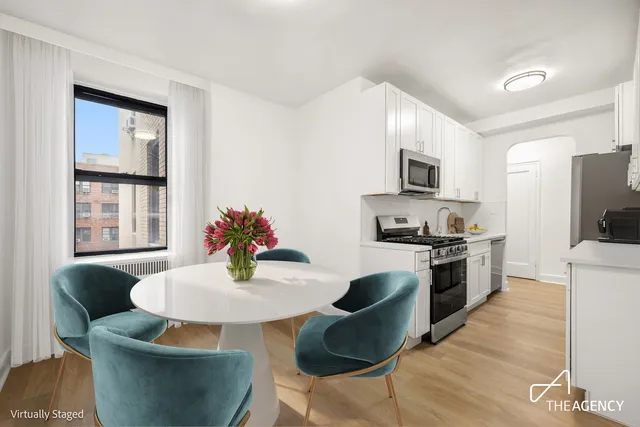 a kitchen with granite countertop a refrigerator stove and sink