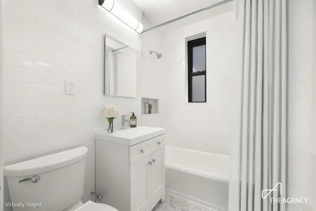 a kitchen with stainless steel appliances kitchen island granite countertop a stove a sink a microwave and a refrigerator