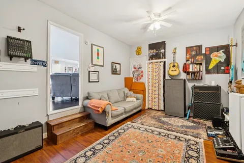 a bedroom with furniture and a flat screen tv