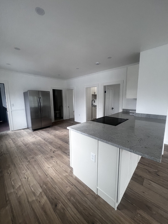 19 Reeves Street Worcester, MA 01607 - Photo 11 of 30 a kitchen with a sink cabinets and wooden floor