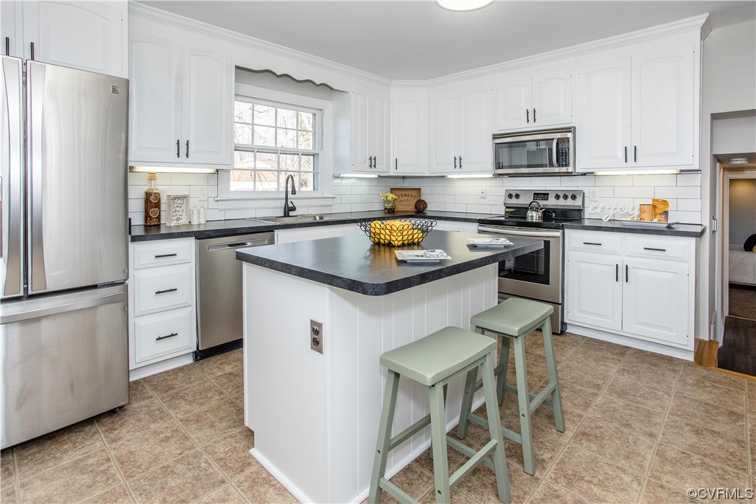 4116 Hidden Valley Road Chester, VA 23831 - Photo 3 of 35 a kitchen with granite countertop white cabinets and white appliances
