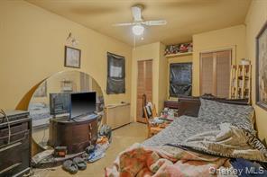 22 Middleville Road Northport, NY 11768 - Photo 14 of 20 Bedroom with a ceiling fan and a closet