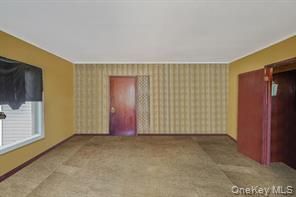 22 Middleville Road Northport, NY 11768 - Photo 17 of 20 Unfurnished living room with baseboards and elevator
