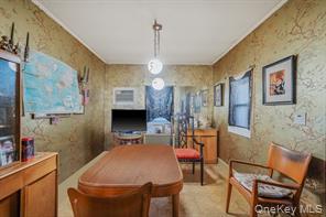 22 Middleville Road Northport, NY 11768 - Photo 8 of 20 Dining area with wallpapered walls and a desk