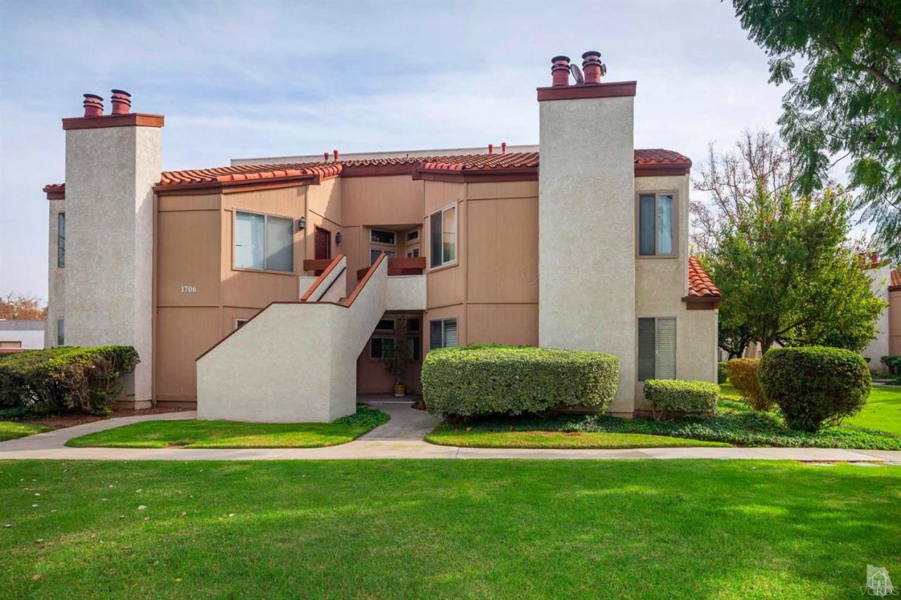 1706 Sinaloa Road, Unit 107 Simi Valley, CA 93065 - Photo 2 of 27 a front view of a house with garden
