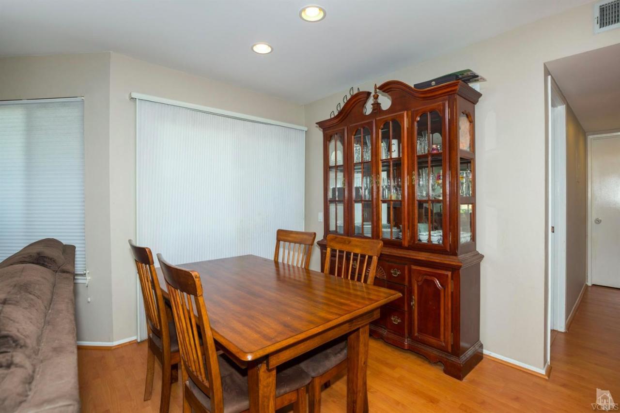 1706 Sinaloa Road, Unit 107 Simi Valley, CA 93065 - Photo 13 of 27 a view of a dining room with furniture and window
