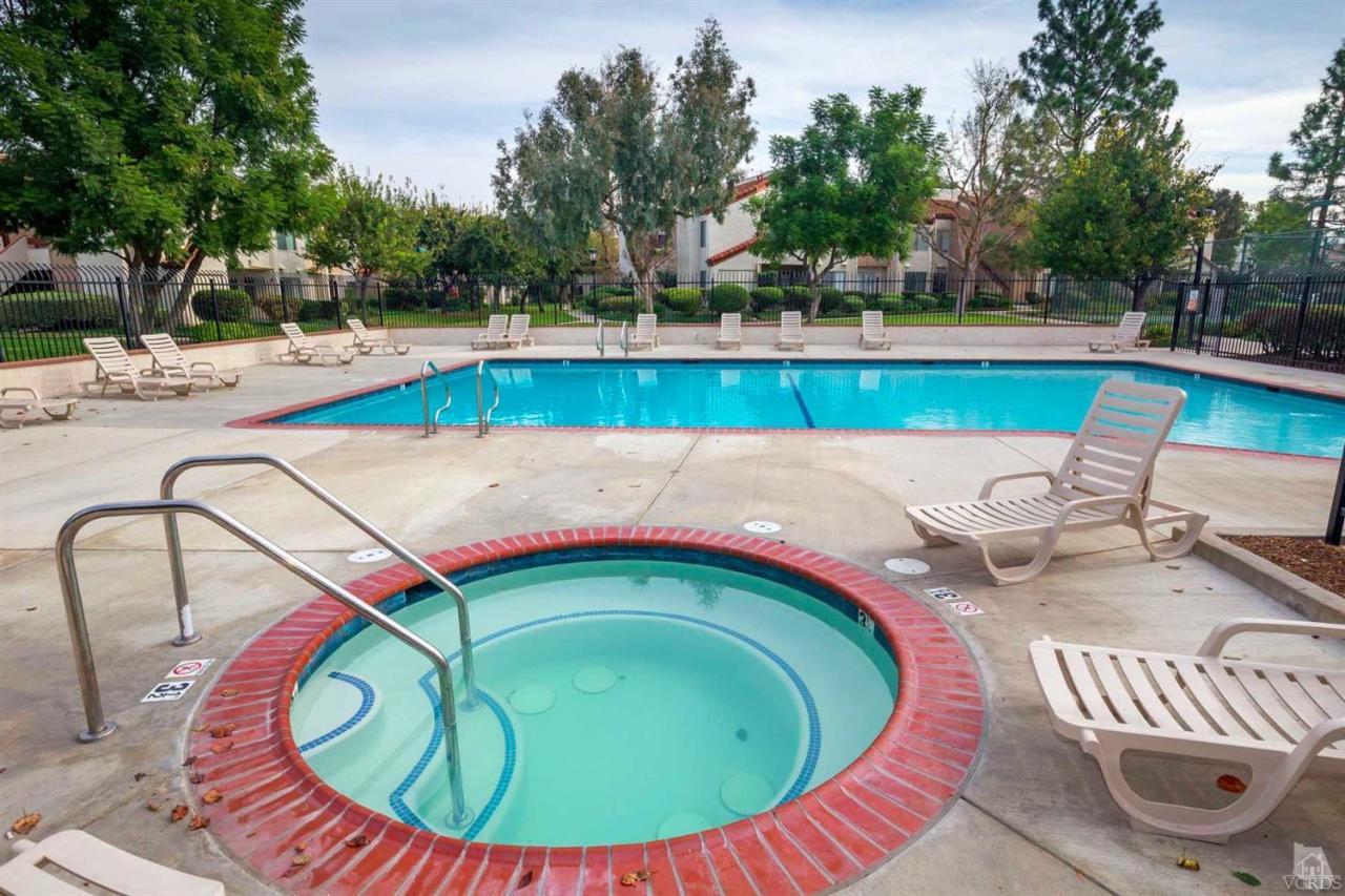1706 Sinaloa Road, Unit 107 Simi Valley, CA 93065 - Photo 16 of 27 a view of a swimming pool with a patio