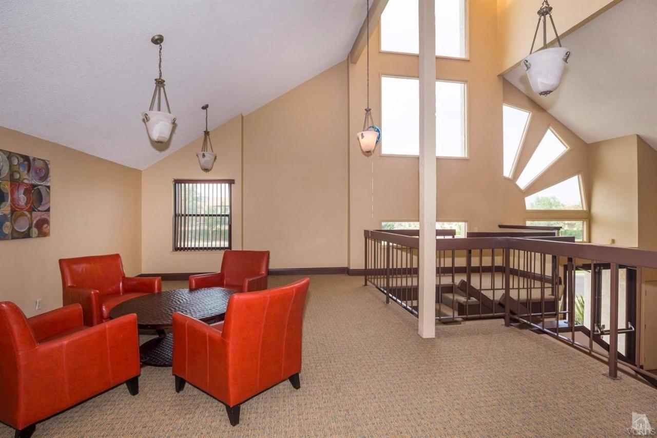 1706 Sinaloa Road, Unit 107 Simi Valley, CA 93065 - Photo 21 of 27 a living room with furniture a ceiling fan and a window