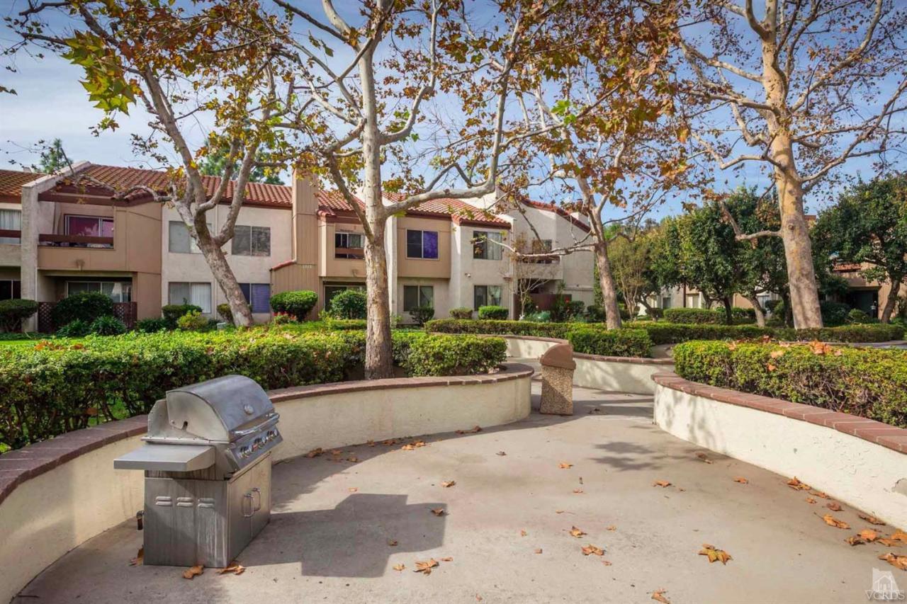 1706 Sinaloa Road, Unit 107 Simi Valley, CA 93065 - Photo 23 of 27 a view of a building with a garden