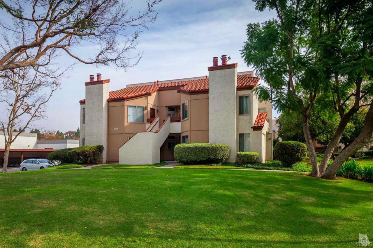 1706 Sinaloa Road, Unit 107 Simi Valley, CA 93065 - Photo 27 of 27 a view of a house with a tree and a garden