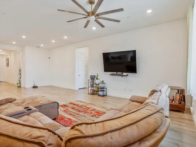 a room with furniture and a flat screen tv