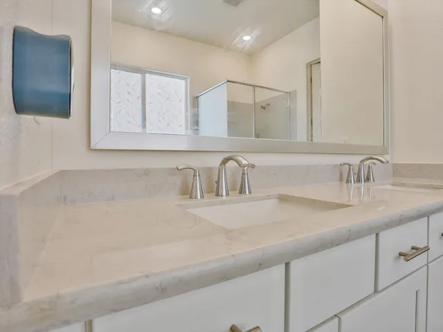 a close view of a sink and a mirror