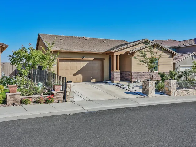 a view of a house with a street