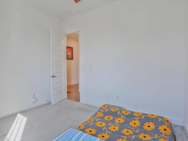a view of an empty room and wooden floor