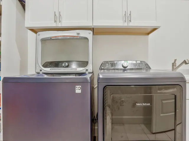 a utility room with washer and dryer
