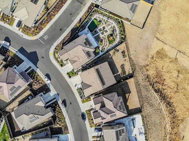 an aerial view of a backyard with wooden floor