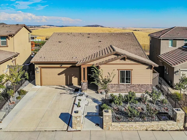 a aerial view of a house with a yard
