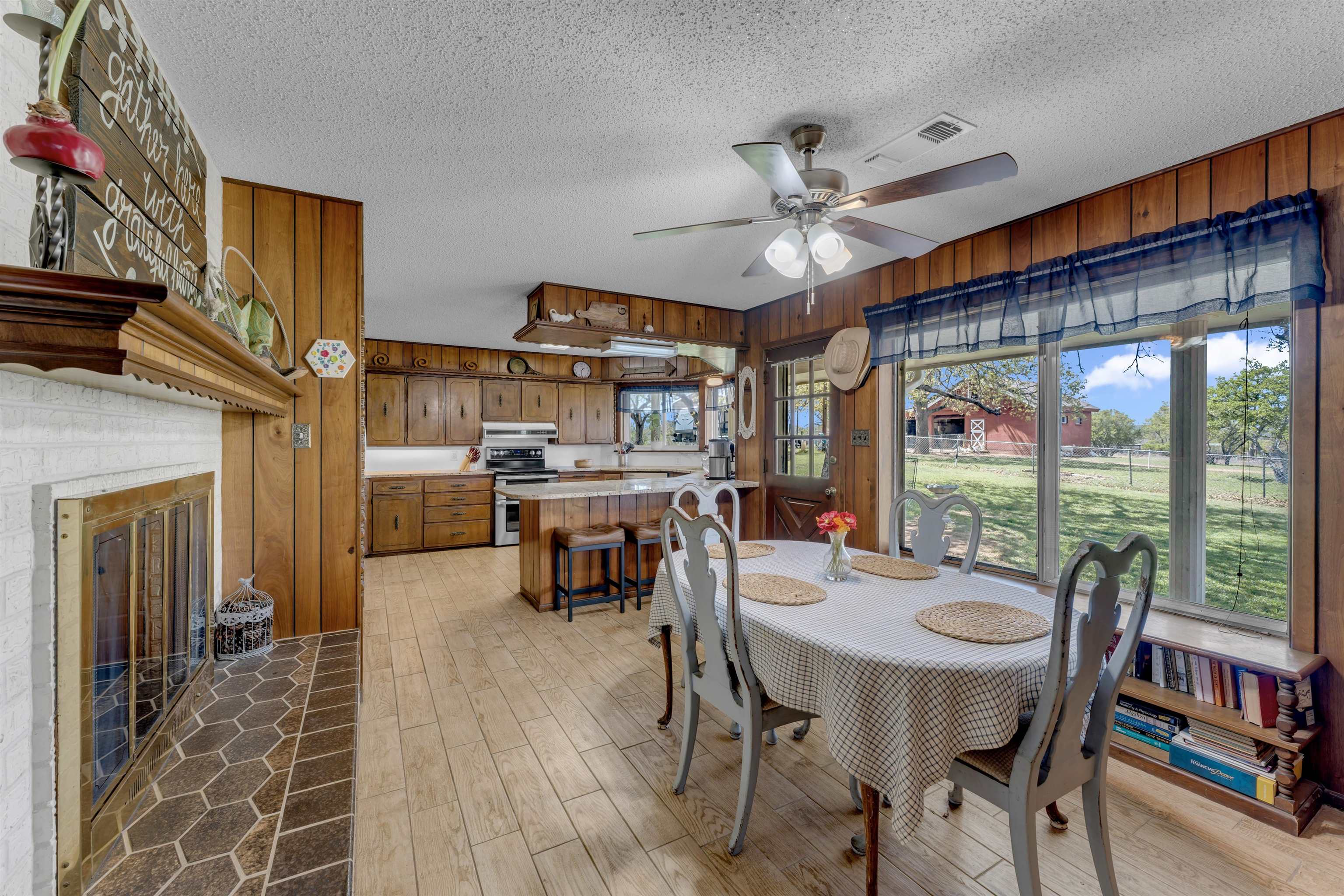 301 Wood Forest Road Kingsland, TX 78639 - Photo 12 of 32 a view of a dining room with furniture window and outside view
