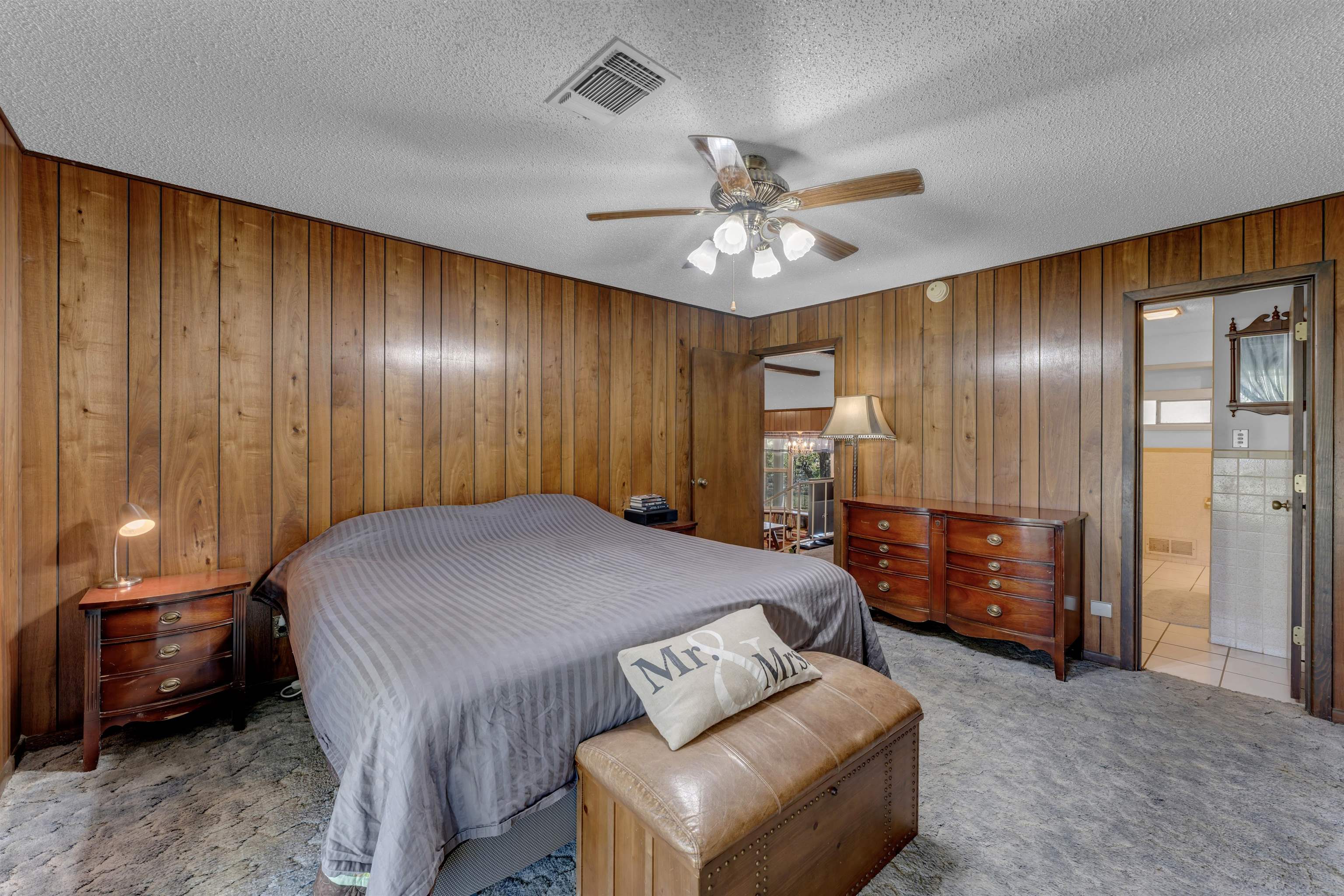 301 Wood Forest Road Kingsland, TX 78639 - Photo 13 of 32 a spacious bedroom with a bed and furniture