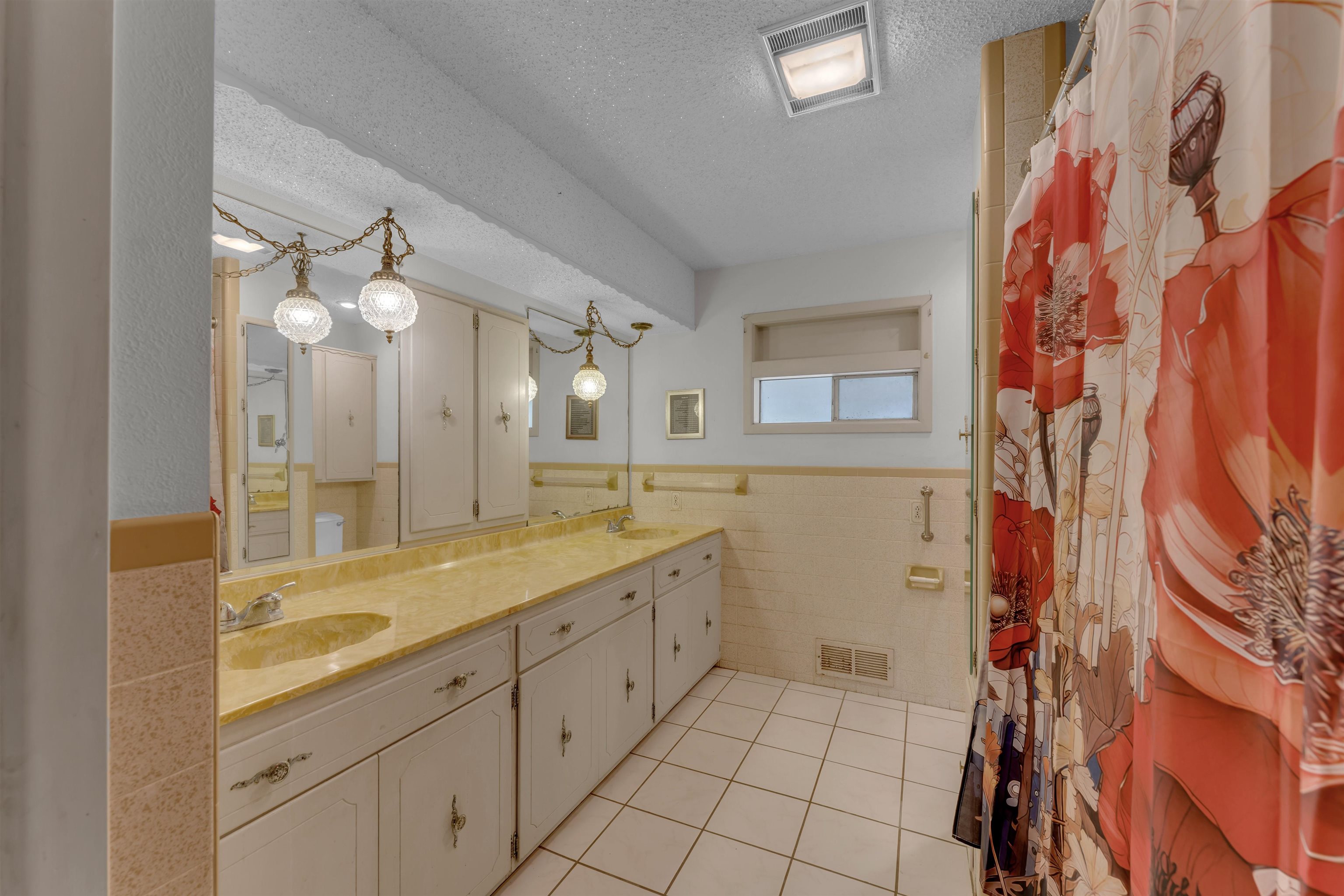 301 Wood Forest Road Kingsland, TX 78639 - Photo 14 of 32 a spacious bathroom with a granite countertop sink a mirror and a shower