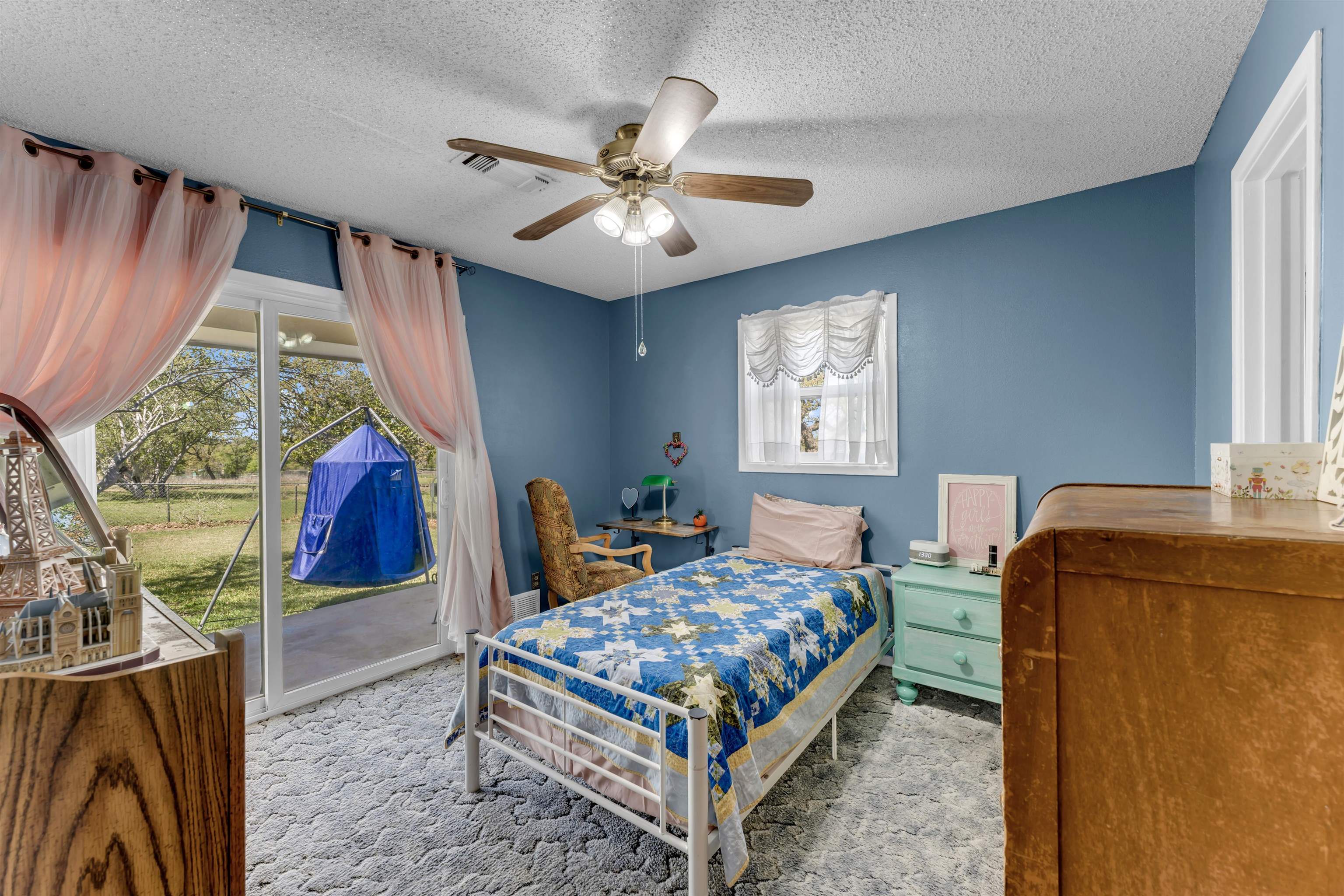 301 Wood Forest Road Kingsland, TX 78639 - Photo 17 of 32 a bedroom with a bed a table and chair