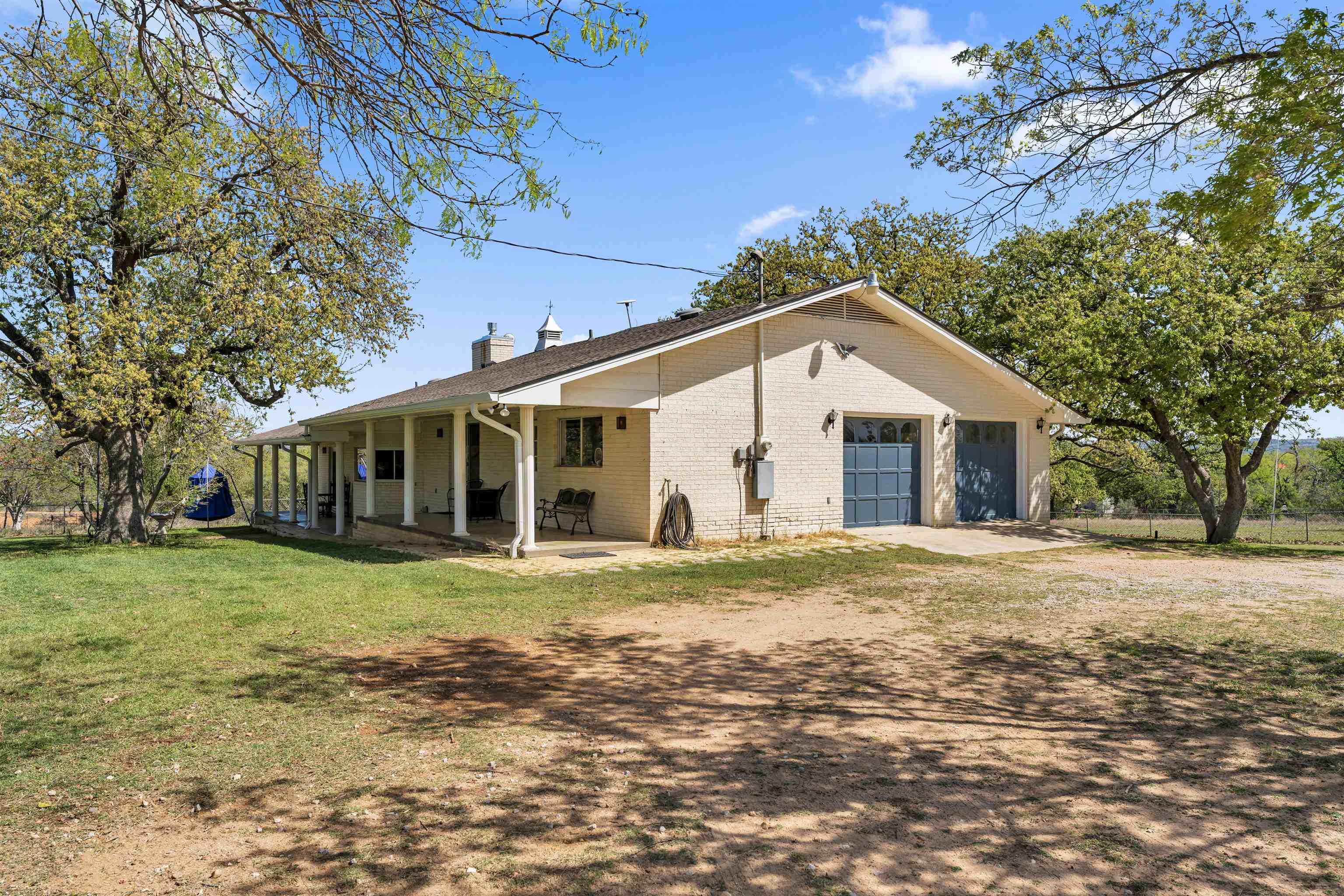 301 Wood Forest Road Kingsland, TX 78639 - Photo 19 of 32 a front view of a house with a yard