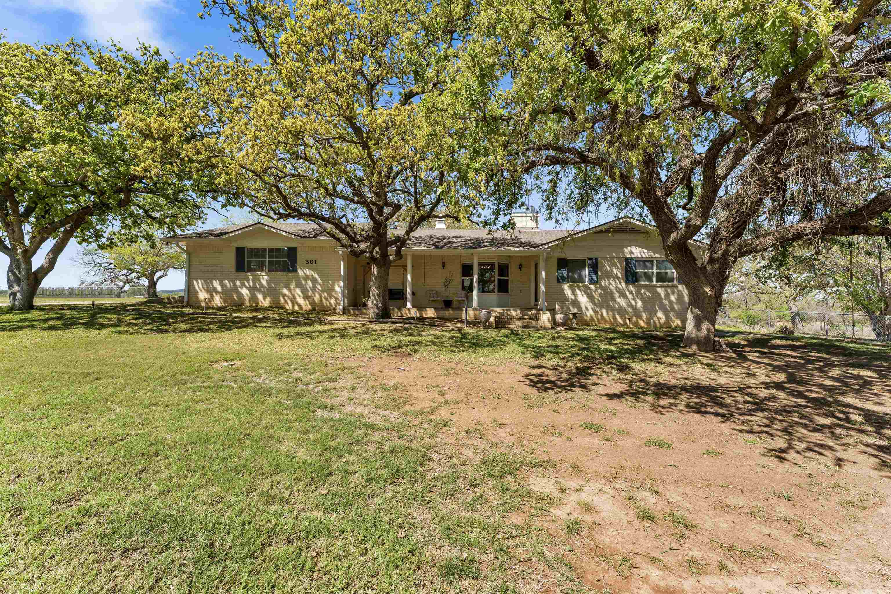 301 Wood Forest Road Kingsland, TX 78639 - Photo 2 of 32 a front view of a house with a yard
