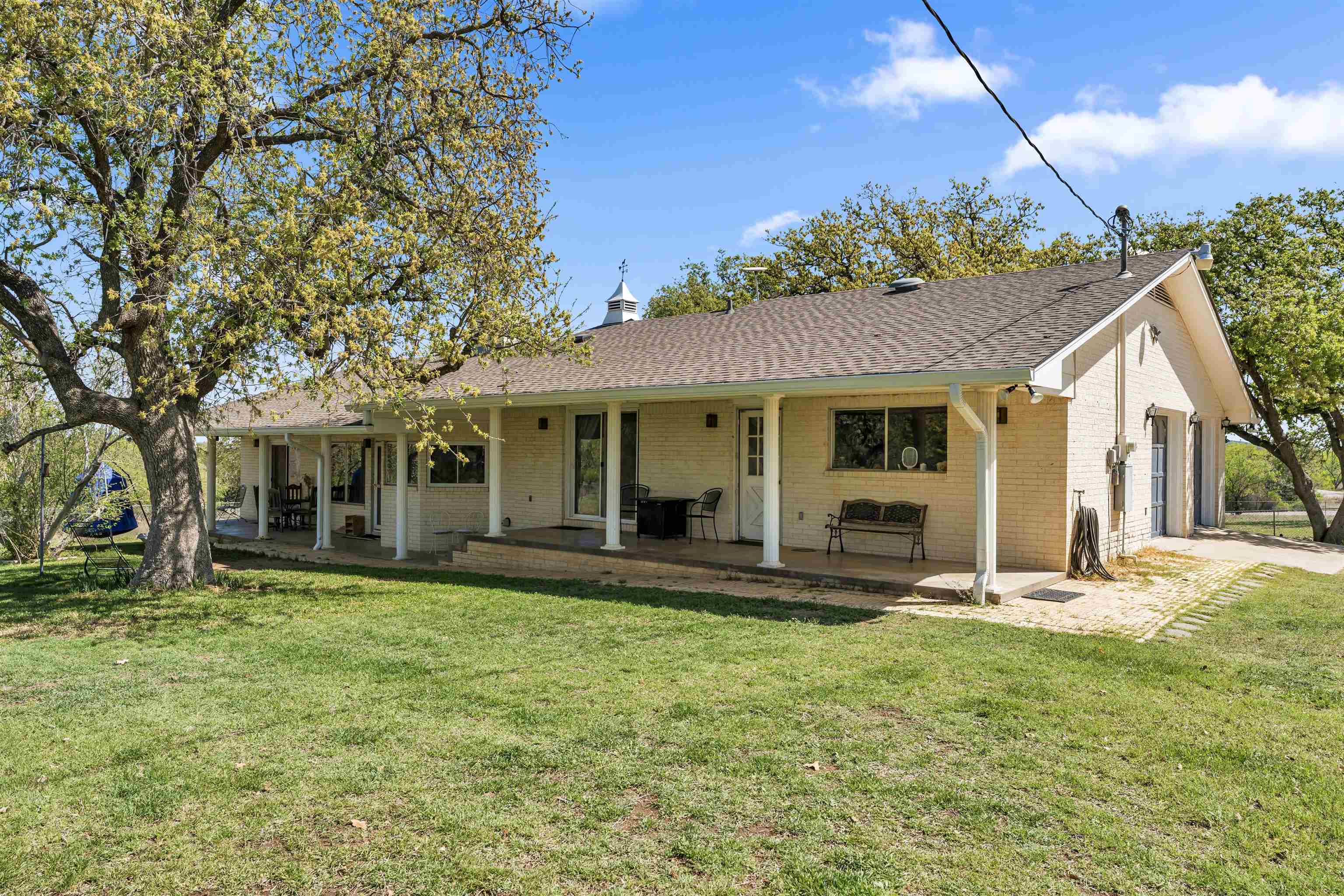 301 Wood Forest Road Kingsland, TX 78639 - Photo 21 of 32 a front view of a house with a yard
